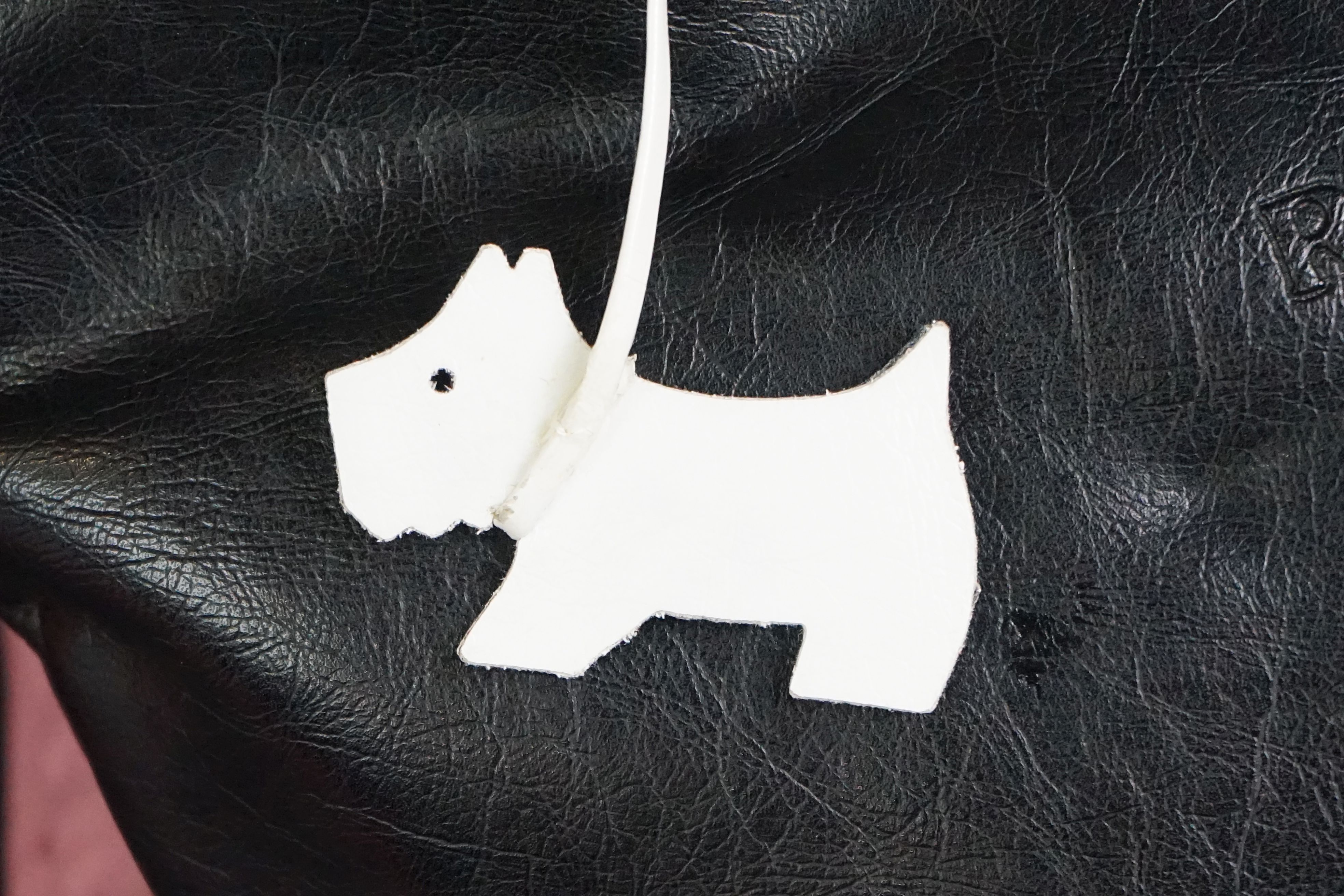 A black Radley handbag with white bow detailing, white Radley dog and pink dust bag. - Image 2 of 7