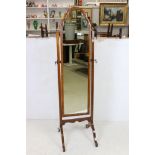 Early 20th century Queen Anne style Walnut Framed Cheval Mirror with brass finials and fittings,
