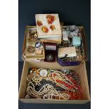 A collection of vintage and contemporary costume jewellery to include brooches and necklaces.