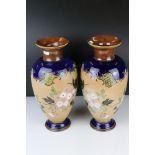 Pair of Royal Doulton Stoneware Vases with blue ground shoulders and foot, the main body decorated