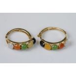 Pair of yellow gold hoop earrings set with semi precious stones