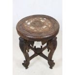 Indian Hardwood Circular Table with bone inlay, the four legs carved in the form of Elephant Heads