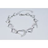 Silver and CZ set graduated heart shaped bracelet