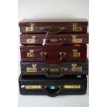 A group of five masonic suitcases complete with contents to include aprons, silver medals and