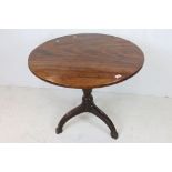 19th century Mahogany Circular Tilt Top Table raised on turned column with three square splayed