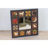 Hand carved and decorated wooden framed mirror by country carving artist A L Pisang, approx. 40cm