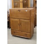 Ercol Windsor Blonde Elm Cocktail / Serving Cabinet, model 469, with fall front above two