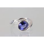 Tanzanite and diamond 18ct white gold ring, the oval mixed cut tanzanite measuring approx 8mm x 6.