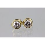 Pair of diamond solitaire 18ct yellow gold stud earrings, each diamond weighing approx 0.50 carat,