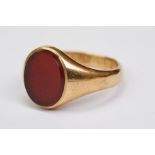 Carnelian 18ct yellow gold signet ring, the oval plain polished carnelian measuring approx 13.5mm