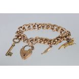 Victorian 9ct rose gold curb link bracelet with padlock clasp and 9ct gold fox charm with ruby eyes,