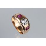 Diamond and ruby unmarked rose gold ring, the central cushion cut diamond weighing approx 1.0 carat,