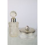 Silver topped cut glass dressing table jar, squat circular form, the engine turned silver lid with