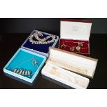 A small collection of boxed jewellery to include silver and gold plated examples.