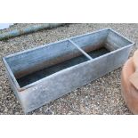 A large outdoor galvanised steel water trough, measures approx 154cm x 48cm x 40cm