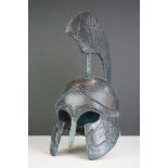 A cast metal ornamental roman centurions helmet.