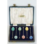 A cased set of six fully hallmarked sterling silver and enamel teaspoons.