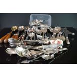 A collection of silver plated cutlery to include salad servers, fish knives, tea spoons ..etc..