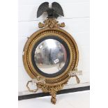 Regency style Gilt Framed Circular Convex Girandole Mirror surmounted by an eagle, 81cm high