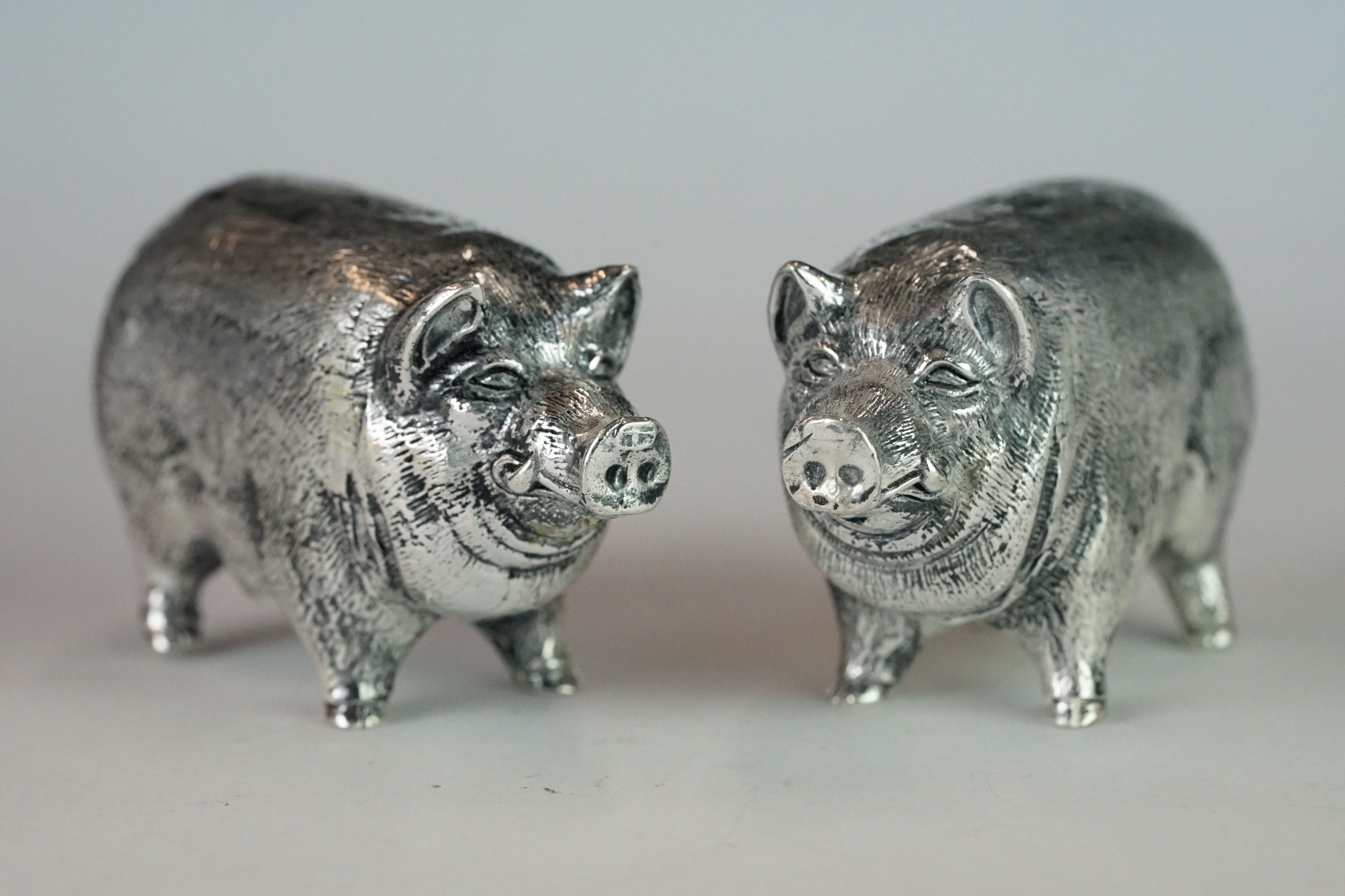 Pair of Pig Condiments stamped 800 to underside