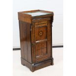 Victorian Aesthetic design Walnut and Ebonised Bedside Cabinet, the single door with inlaid flower