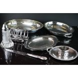 A collection of mixed silver plate to include toast rack, serving dish, sugar shakers...etc.