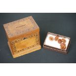 An antique wooden money box with inlay decoration together with Six Chinese Cherry Stone Carved