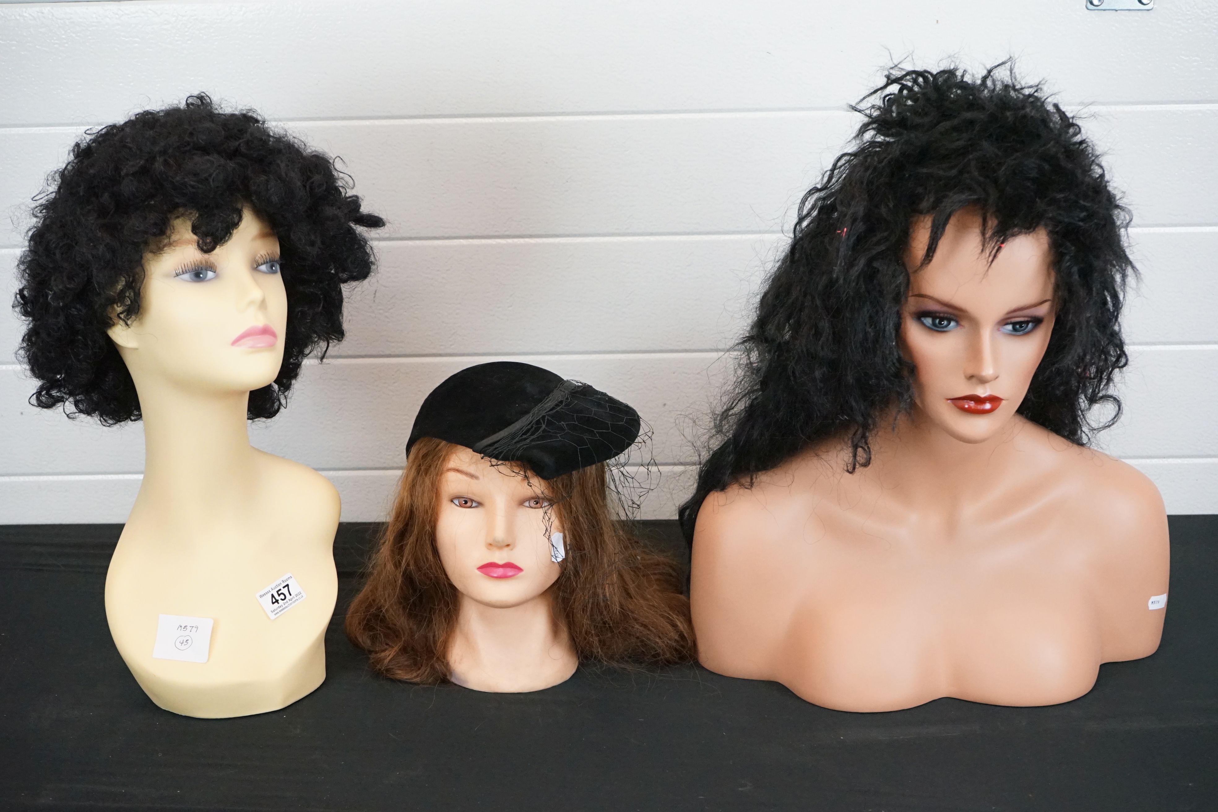 A collection of three contemporary shop display mannequin heads.