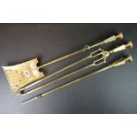 A set of three Art Deco brass fireside tools to include poker, shovel and tongs.