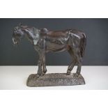 A cast iron door stop in the form of a horse, maker marked to base.