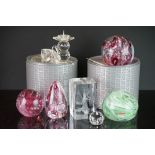 A small collection of glass paperweights together with a small group of crystal ornaments.