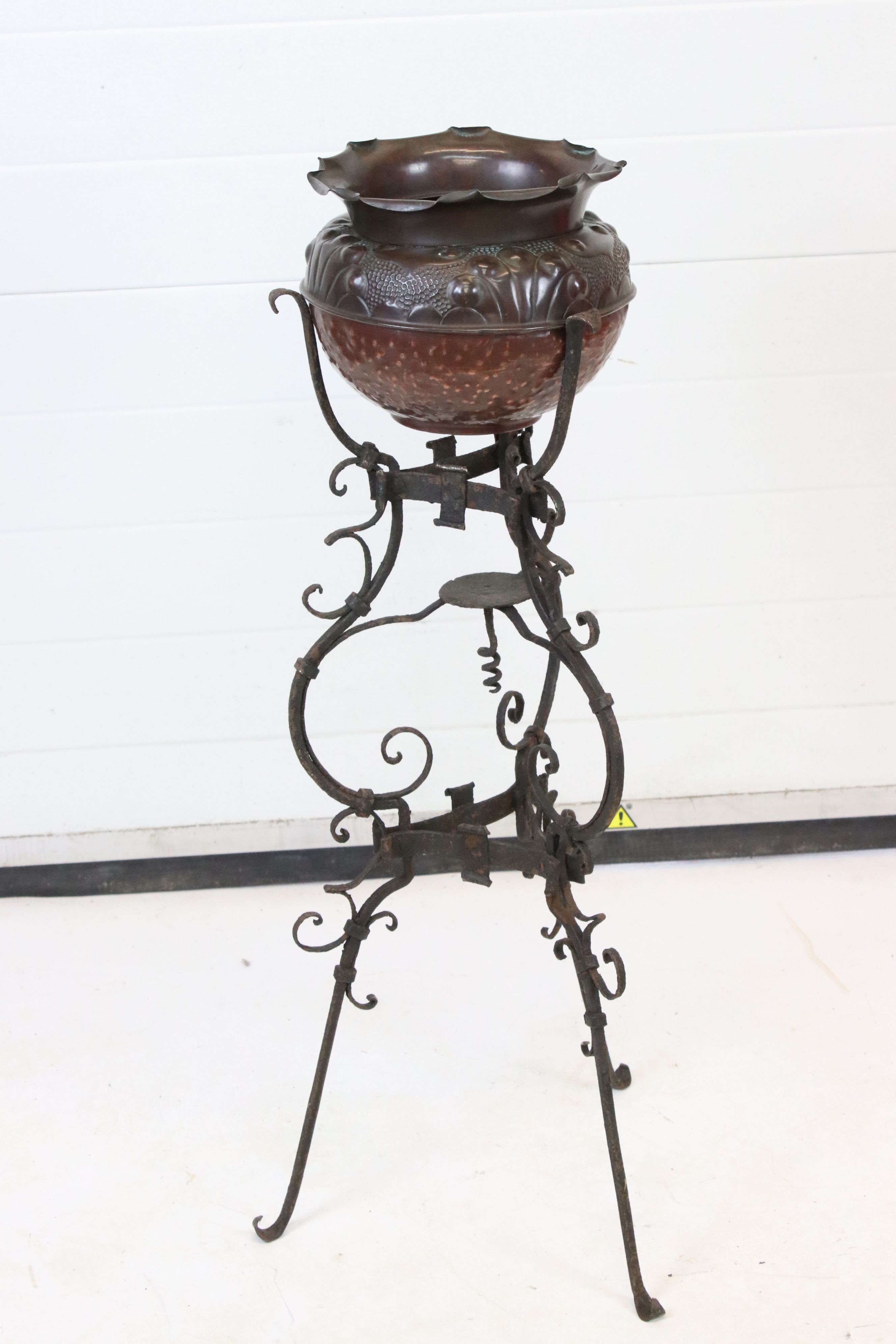 Early 19th century Ornate Wrought Iron Tripod Stand with a later Art Nouveau Copper Jardiniere