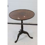 George III Mahogany Pedestal Table with one piece dish top raised on three carved splay legs, 62cm