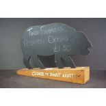 Pig silhouette cider advertising sign