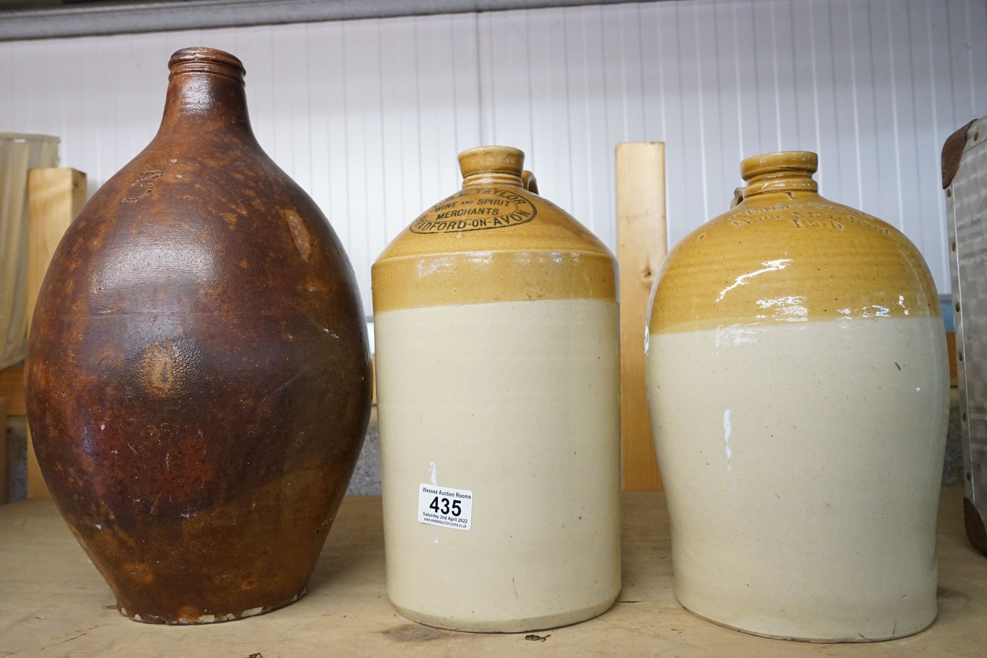 Three stoneware bottles to include a Bradford On Avon advertising example.