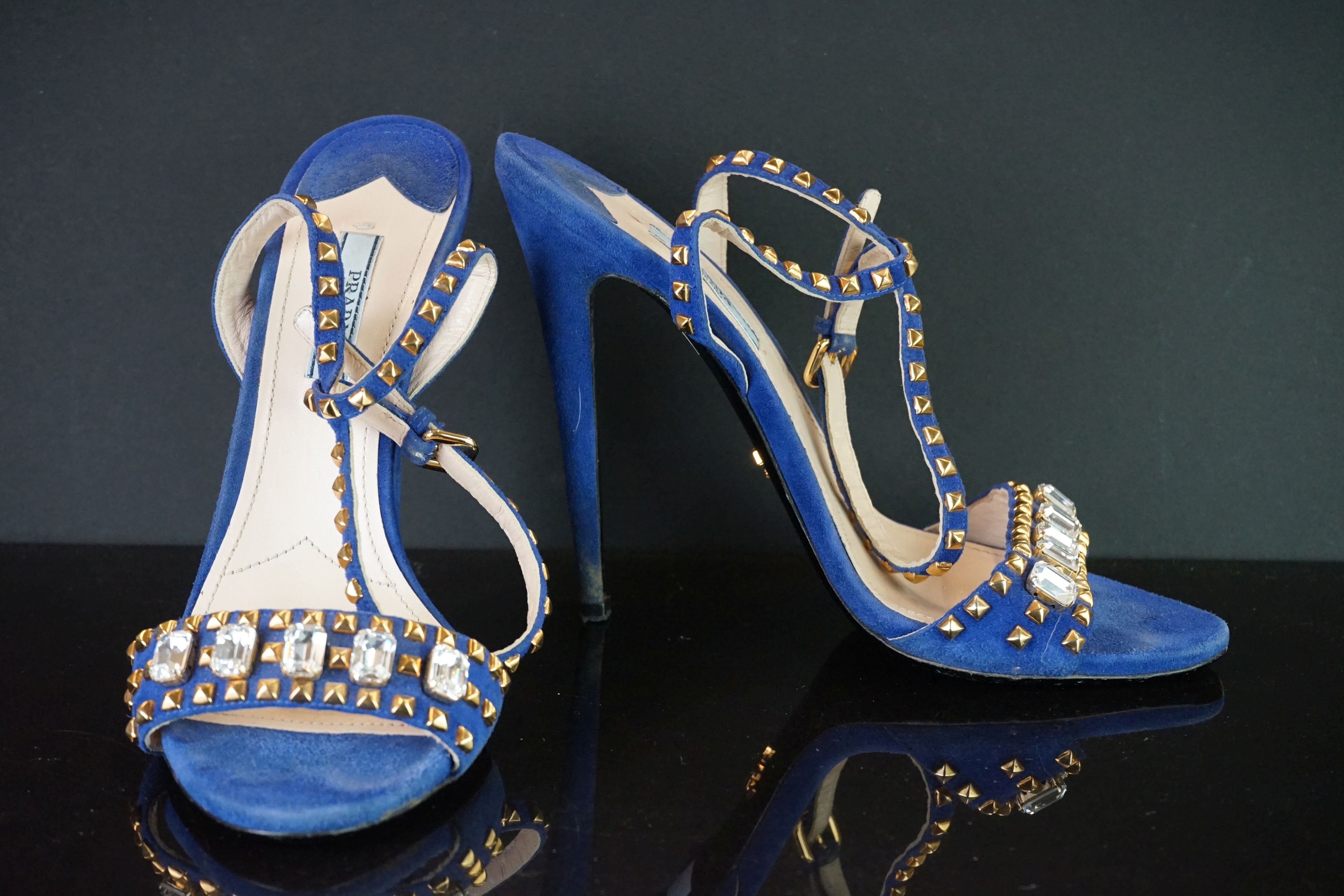 A pair of blue Prada hight heel shoes with gold studs and clear jewels, size 41.