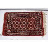 Eastern Wool Rug, red ground with a geometric pattern within a border, approximately 147cm x 94cm