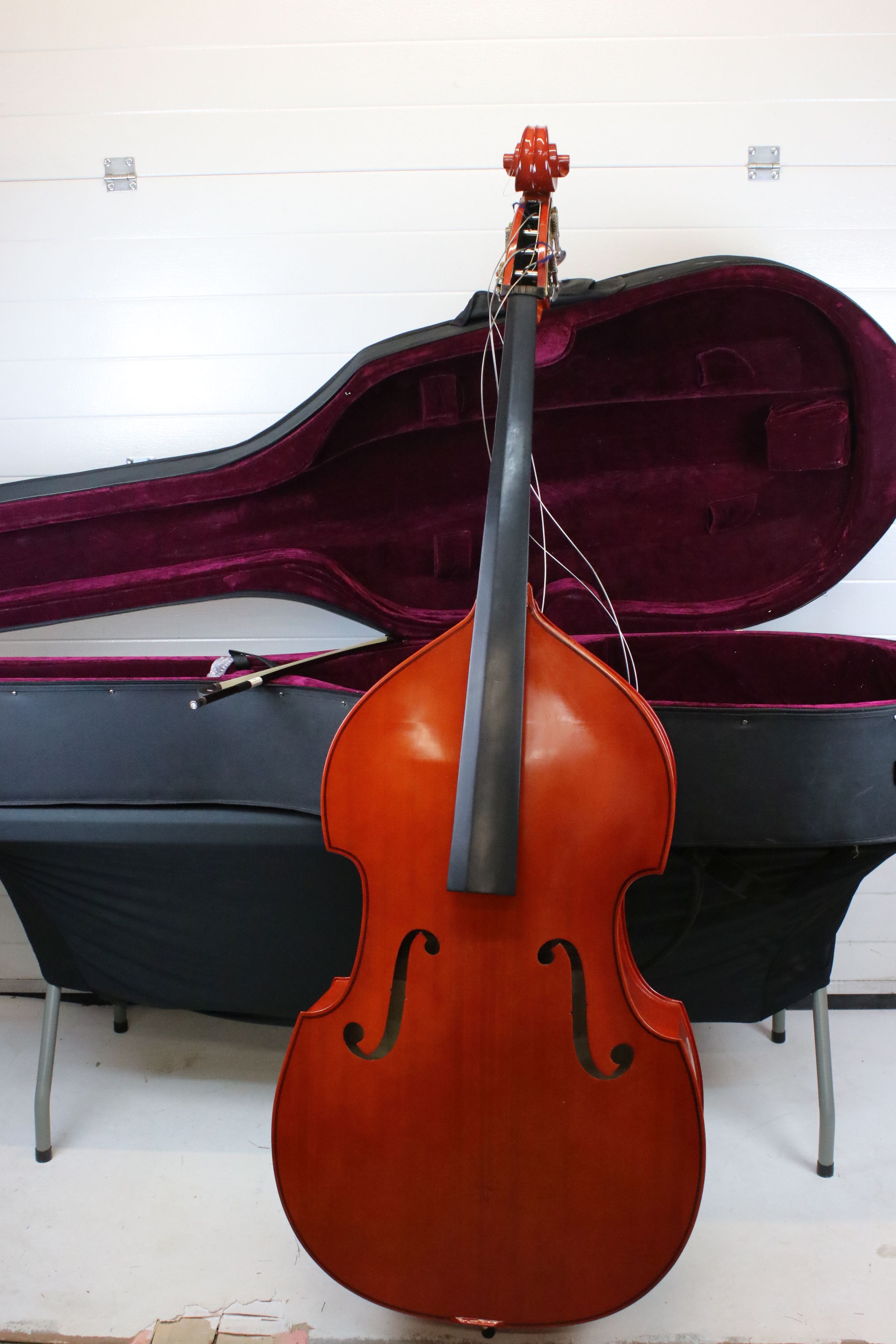 A full size upright double bass together with protective gig bag. Missing bridge (A/F See Images).