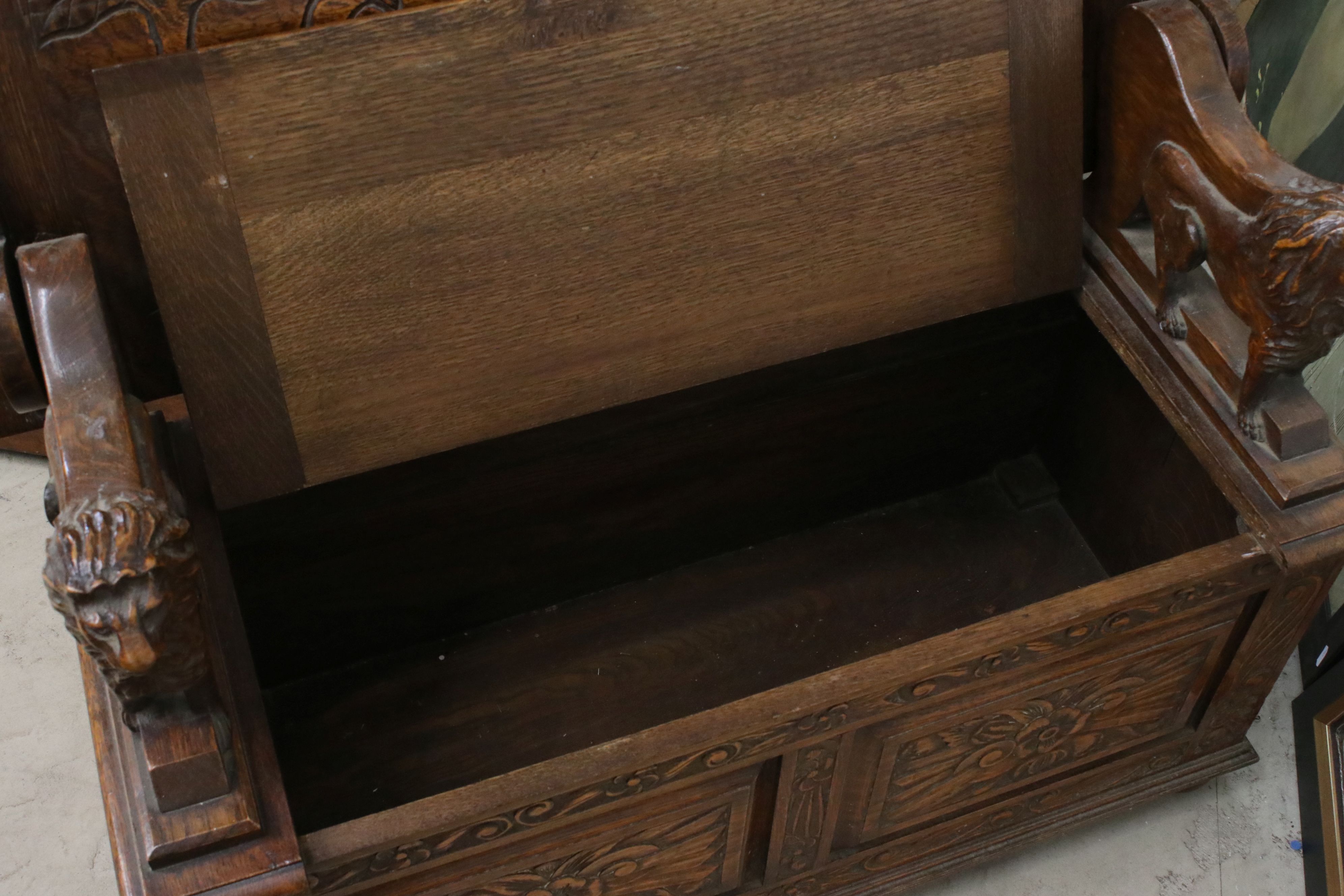 Early 20th century Oak Monk's Bench, the hinged top opening to show a carved scene of George and the - Image 7 of 7