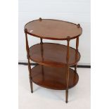 Regency style Mahogany Three Tier Oval Etagere raised on slender turned supports, 57cm wide x 80cm