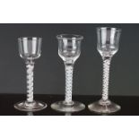 Three Antique Wine Glasses all with opaque twist stems and ogee shaped bowls, tallest 16cm