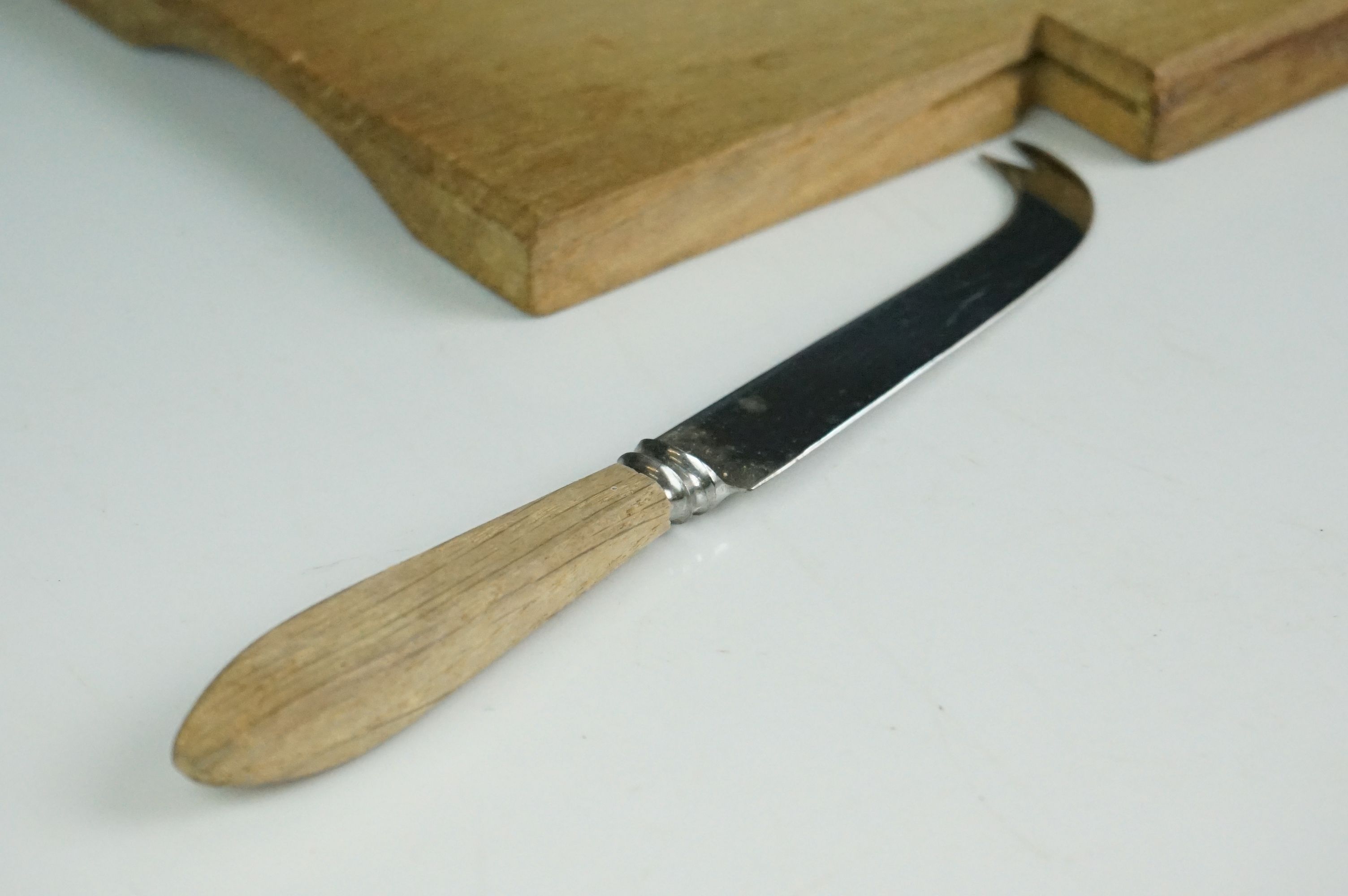 A wooden cheese board and cheese knife in the style of Mouseman Robert Thompson. - Image 5 of 6