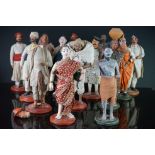 A collection of asian figures in traditional dress.