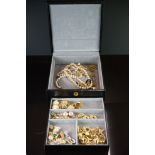 A collection of contemporary mainly gold coloured costume jewellery contained within jewellery box.