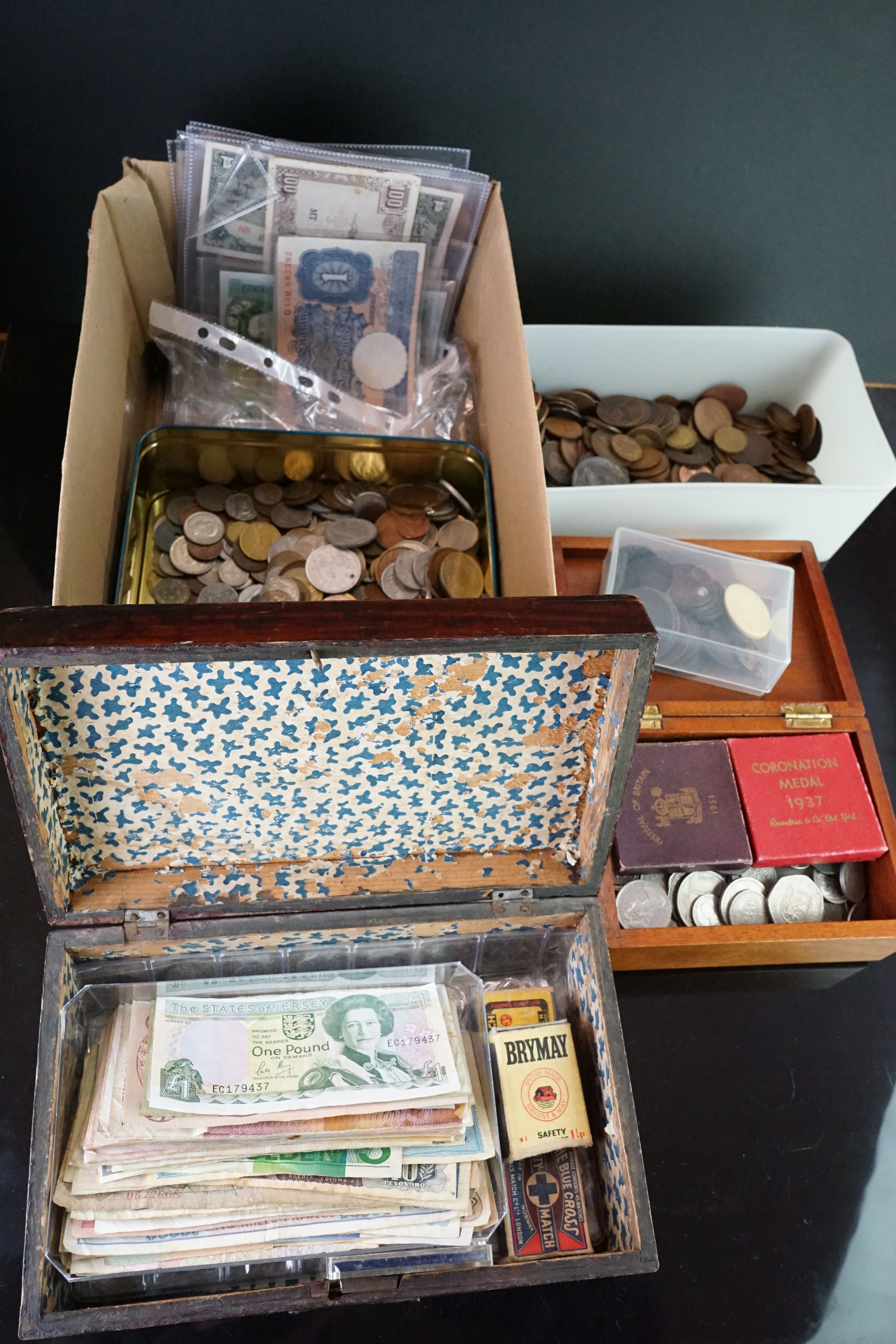 A large collection of mixed coins and banknotes to include British pre decimal and foreign examples.