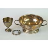 A sterling silver twin handled dish together with a hallmarked silver egg cup.