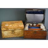 A wooden vanity case complete with bottles and jar with white metal lids together with another