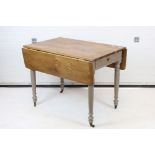 19th century Pine Drop Flap Kitchen Table with drawer to end, raised on a painted base with turned