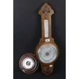 A oak wall hanging Aneroid barometer with mercury thermometer together with another barometer.