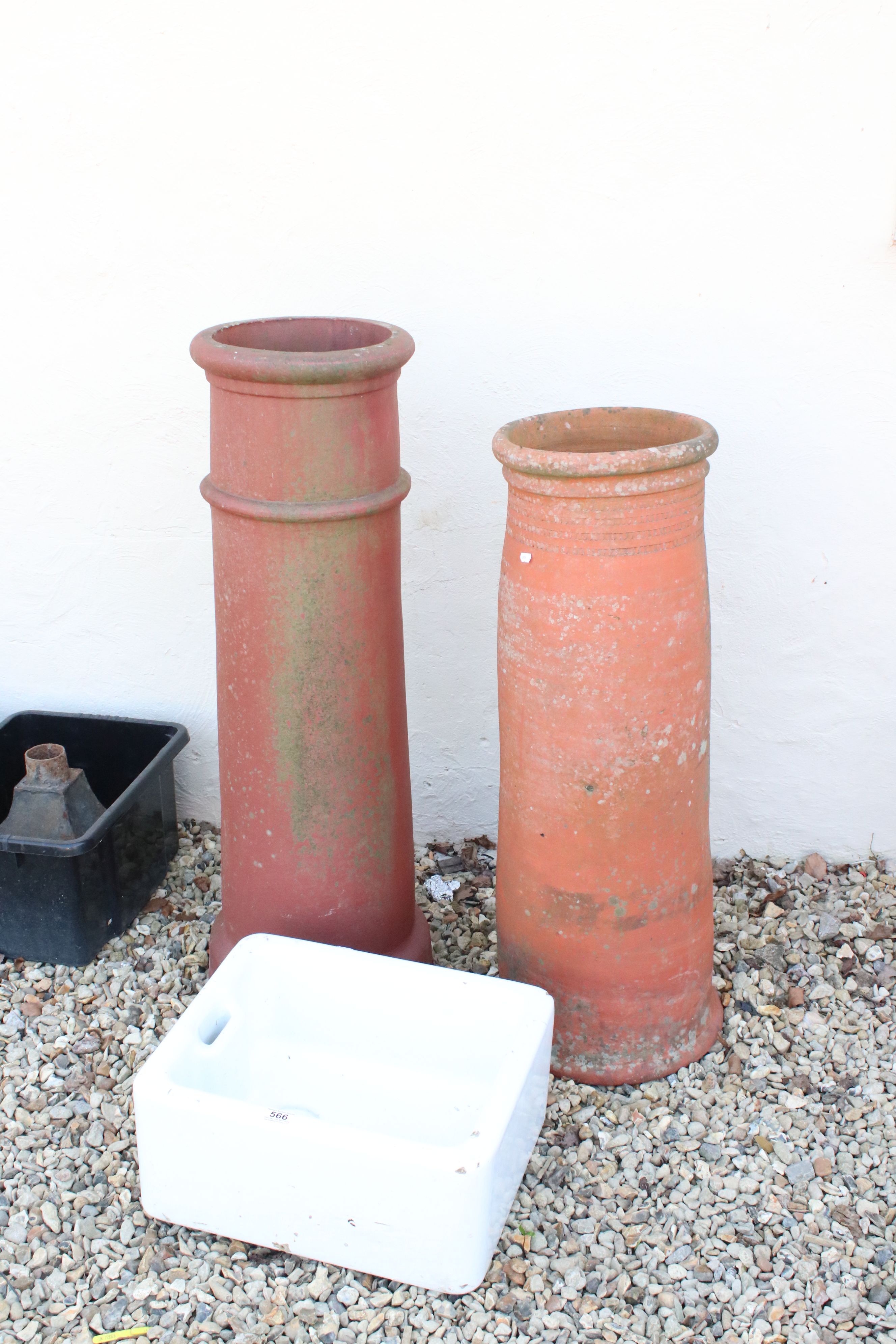 A Belfast sink together with two large chimney pots.